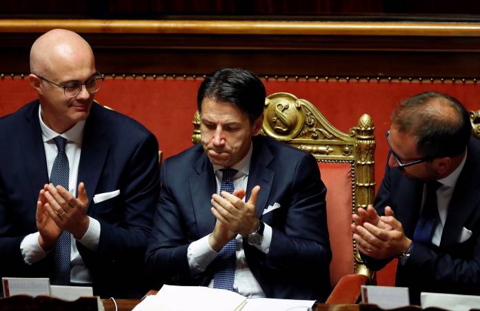 Italian Prime Minister Giuseppe Conte reacts after a confidence vote in the Senate in Rome