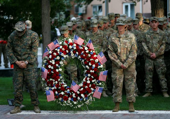 U.S. soldiers take part in a memorial ceremony to commemorate the 16th anniversary of the 9/11 attacks, in Kabul