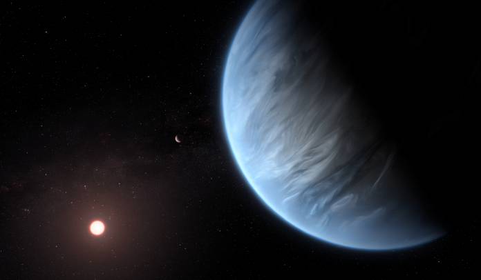 An artist's impression shows the planet K2-18b, its host star and an accompanying planet