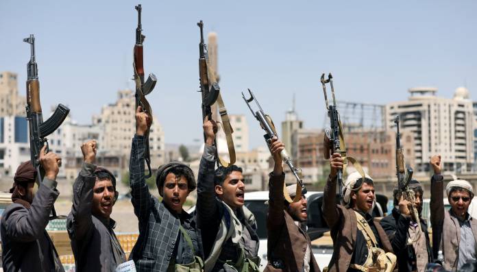 FILE PHOTO: Houthi followers attend a gathering to receive food supplies from tribesmen in Sanaa