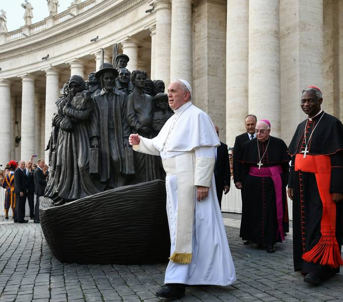 Pope Francis attends the unveiling of a sculpture depicting a group of migrants of various cultures and from different historic times, following a mass for World Day of Migrants and Refugees, at St. Peter's Square at the Vatican