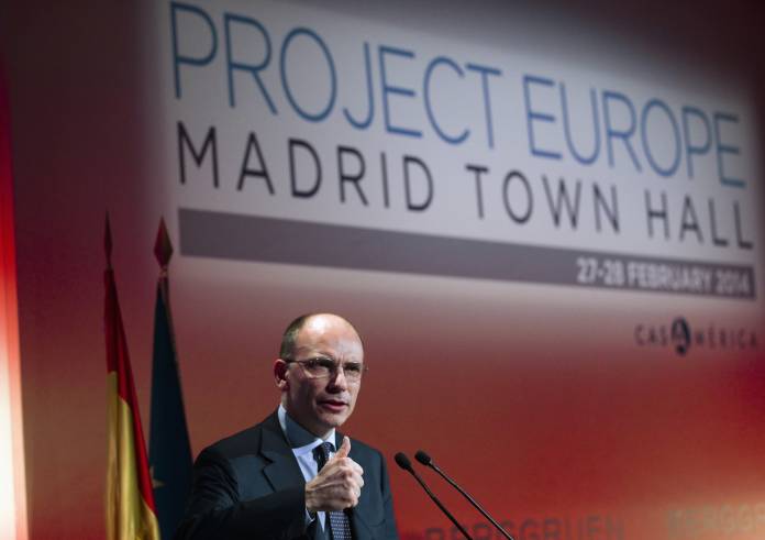 Former Italy's Prime Minister Enrico Letta gestures as he delivers a keynote speech during the