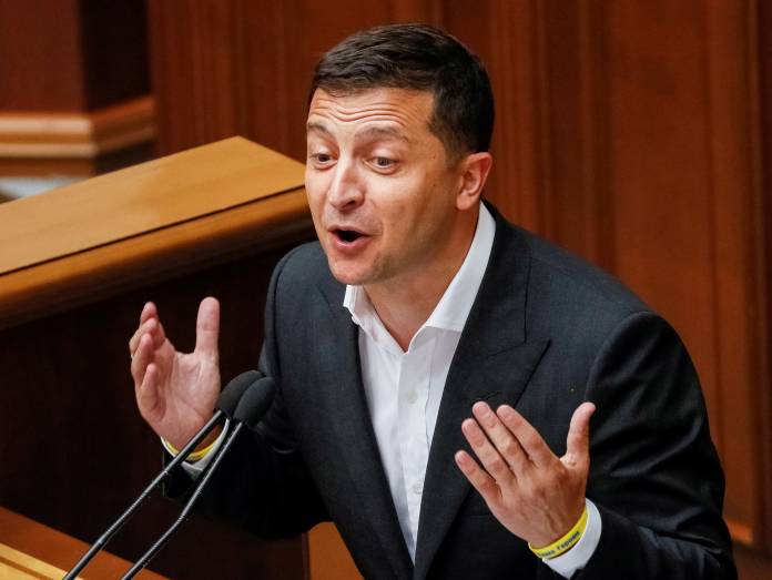 FILE PHOTO: Ukrainian President Volodymyr Zelenskiy delivers a speech during a parliamentary session in Kiev