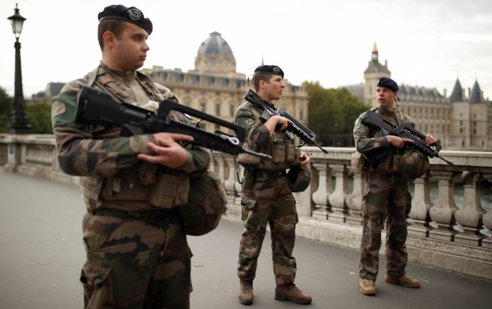 Security personnel is seen after an attack on the police headquarters in Paris