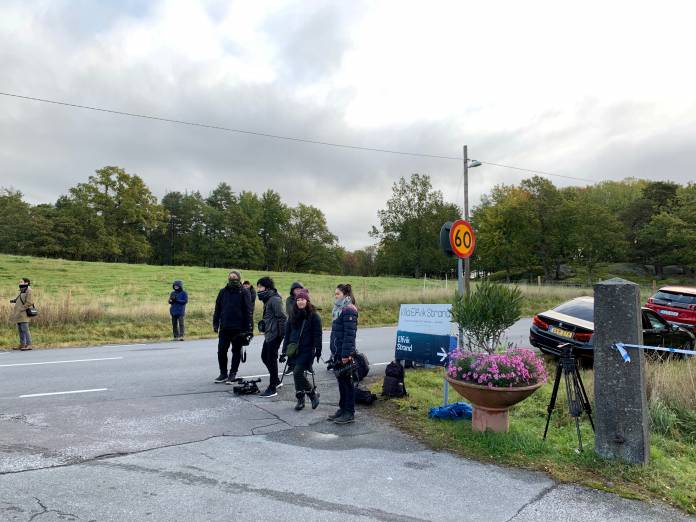 Members of the press wait outside Villa Elfik Strand at Lidingo