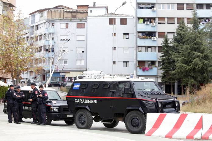 Italian Carabinieri, members of the NATO Kosovo Force (KFOR), stand guard at the main bridge in Mitrovica