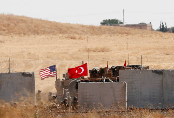 FILE PHOTO: Turkish and U.S. troops return from a joint U.S.-Turkey patrol in northern Syria, as it is pictured from near the Turkish town of Akcakale