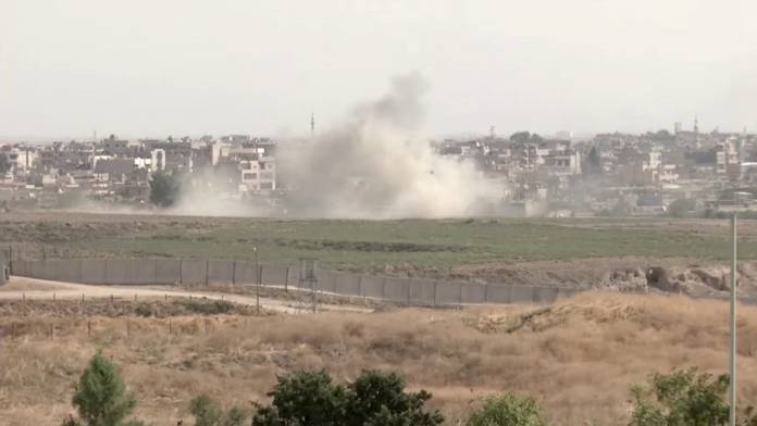 Smoke billows out after Turkish shelling on the Syrian border towns of Qamishli and Ras Al Ain