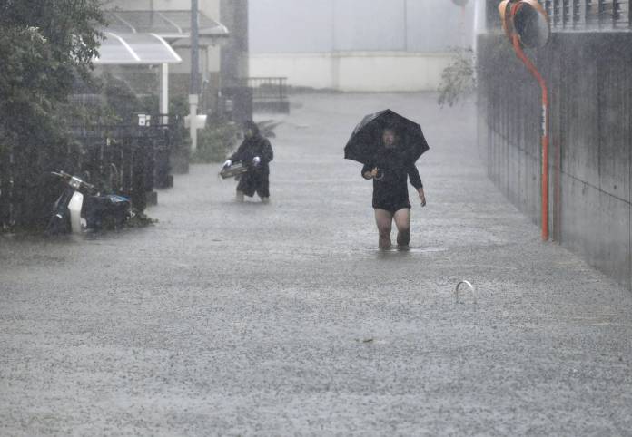 Roads are flooded due to heavy rains caused by Typhoon Hagibis in Shizuoka, Japan