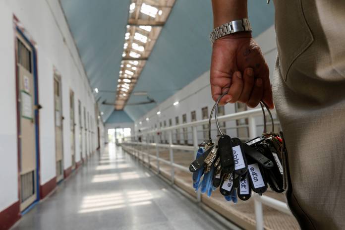 A guard holds keys in the long-term sentence zone inside Klong Prem high-security prison