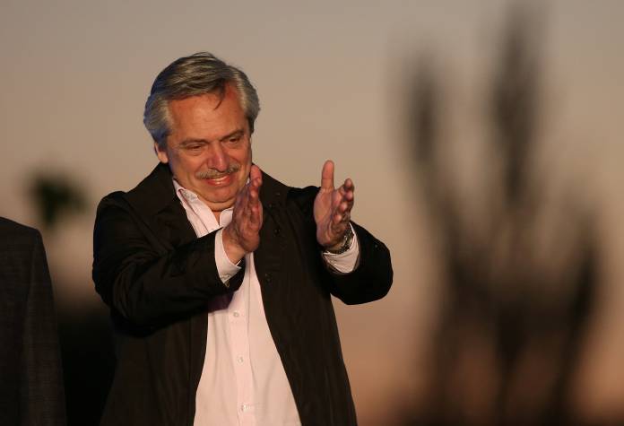 Presidential candidate Alberto Fernandez applauds during a campaign rally in Santa Rosa