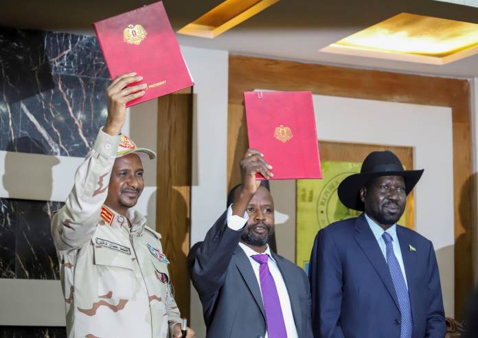 General Mohamed Hamdan Dagalo Deputy Head of the Sudan Transitional Military Council, Alhadi Idris, Chairman of the Sudanese Revolutionary Front and South Sudan President Salva Kiir hold the agreement on peace and ceasefire during the signing cere