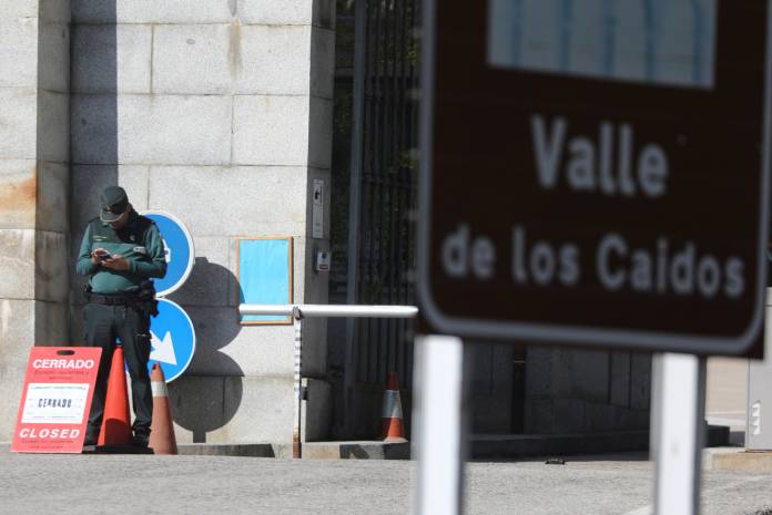 A Spanish Civil Guard officer stands in the closed entrance of the Valle de los Caidos (The Valley of the Fallen), in San Lorenzo de El Escorial