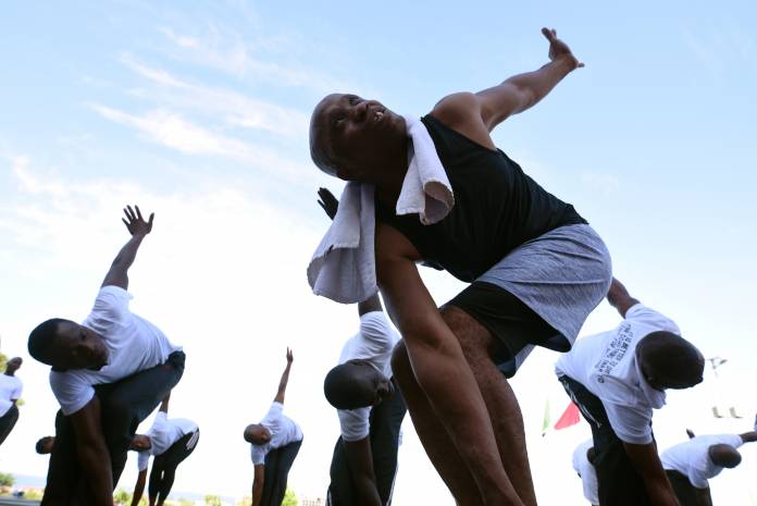 Sergent Felixon Musa, head yoga teacher for the Sierra Leone Armed Forces, leads a session at the country's military headquarters in Freetown
