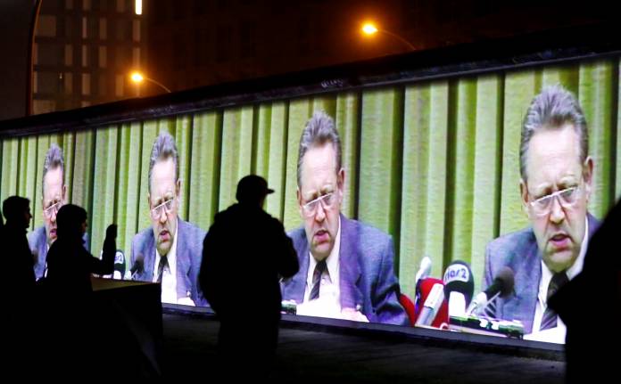 FILE PHOTO: Historic video footage from former official of the Socialist Unity Party of Germany Guenter Schabowski is projected during a rehearsal with 3D video beamers on the East Side Gallery, the largest remaining part of the former Berlin Wall, in Berl