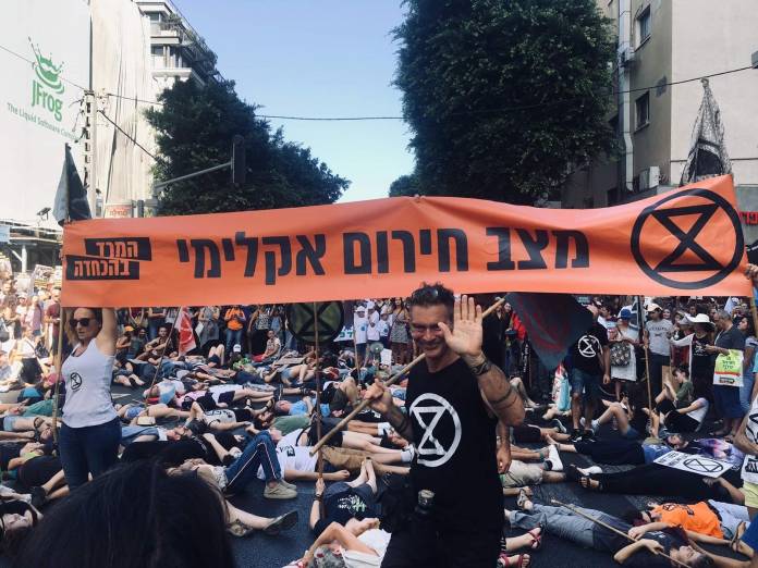 Extinction Rebellion protesters take part in a 'die-in' on 27 October 2019 in Tel Aviv, Israel. Photo Courtesy of Michael Raphael.