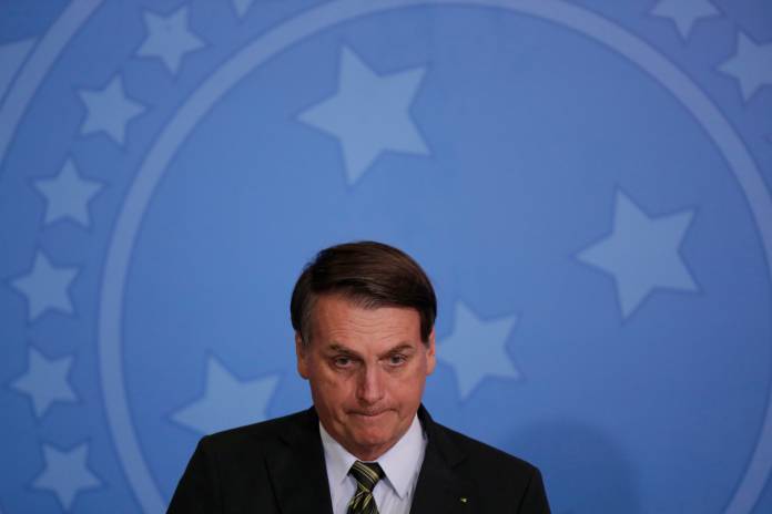 Brazil's President Bolsonaro attends the launch of the Green and Yellow program at the Planalto Palace in Brasilia