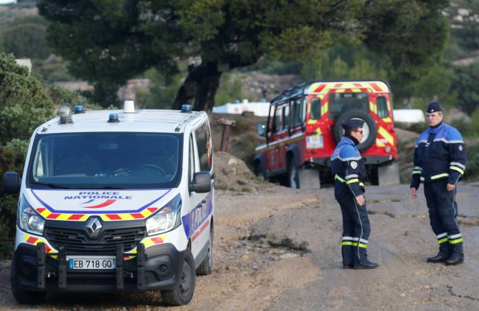 French police secure the area around the site where a helicopter from the civil security services crashed near Marseille