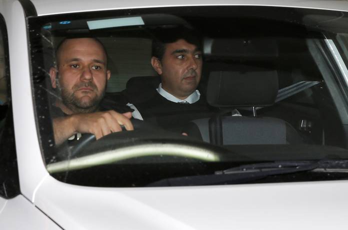 Melvin Theuma, who allegedly acted as a middle man in a plot to murder of journalist Daphne Caruana Galizia, is seen in a police car as he leaves the Courts of Justice in Valletta