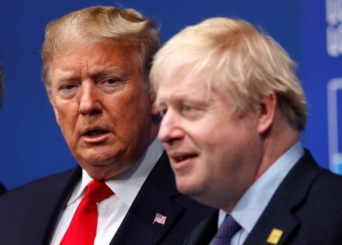 Britain's Prime Minister Boris Johnson welcomes U.S. President Donald Trump at the NATO leaders summit in Watford