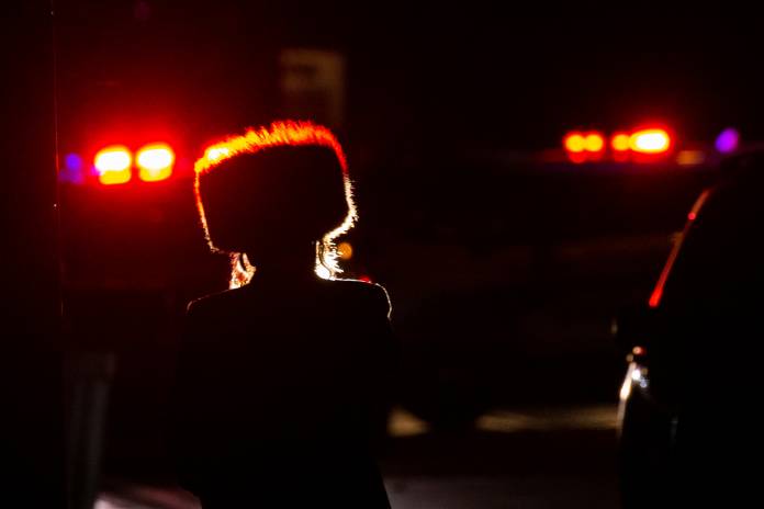 A Jewish man walks near the area where 5 people were stabbed at a Hasidic rabbi's home in Monsey, New York