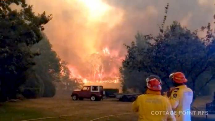 FILE PHOTO: Firefighters at a bushfires in Bilpin, New South Wales, Australia