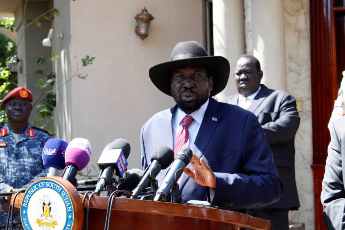 South Sudan's President Kiir speaks during news statement with former VP and rebel leader Machar after their meeting Juba