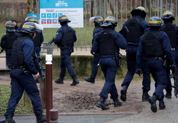 French police secure an area after a knife attack in a public park in Villejuif