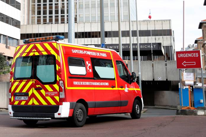 An emergency vehicle arrives at the Bichat Hospital in Paris