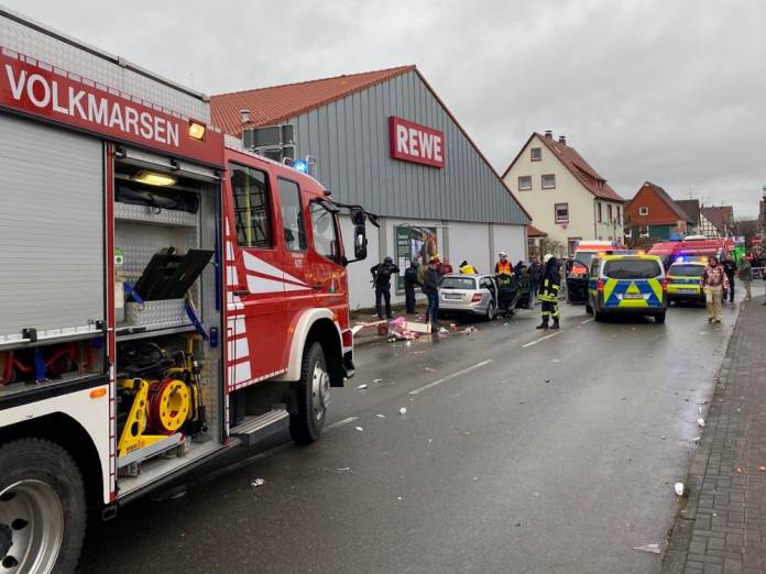 People react at the scene after a car ploughed into a carnival parade injuring several people in Volkmarsen