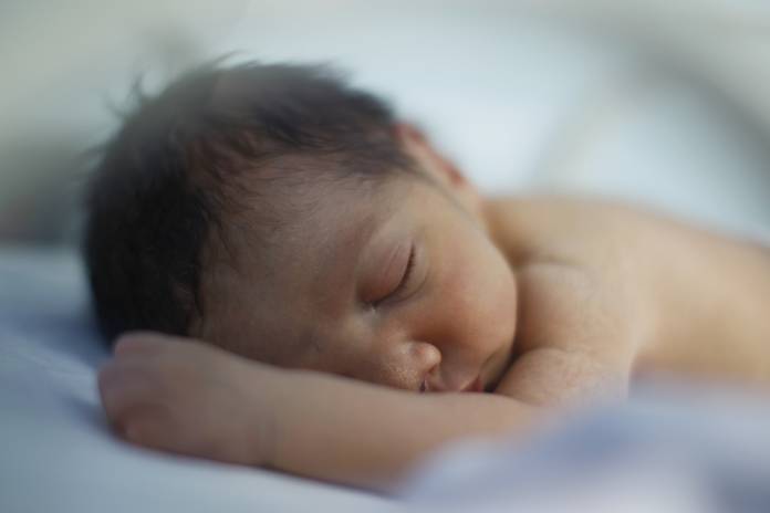 A premature baby sleeps in an incubator in the natal intensive care unit in a public maternity hospital in Gatire