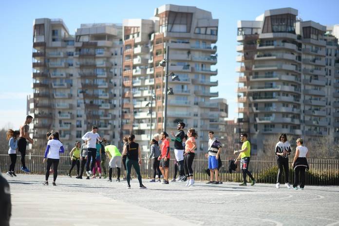 People train in a local park as gyms are closed as part of measures to try and contain a coronavirus outbreak, in Milan