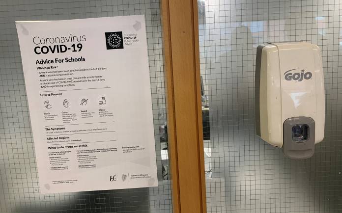 A coronavirus advice notice is seen next to an anti-bacterial gel dispenser in a college in Dublin, Ireland A coronavirus advice notice is seen next to an anti-bacterial gel dispenser in a college in Dublin, Ireland