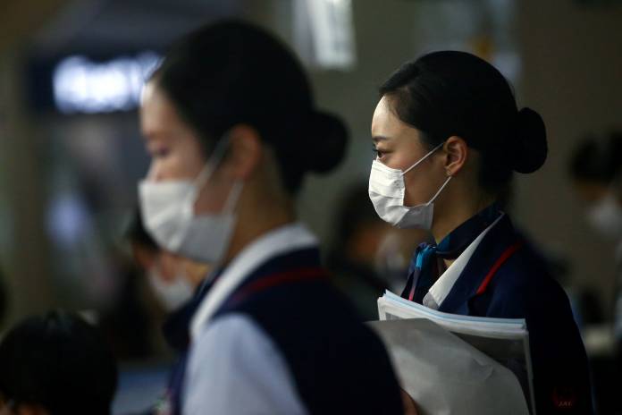 Employes are pictured at the Kansai International Airport in Osaka