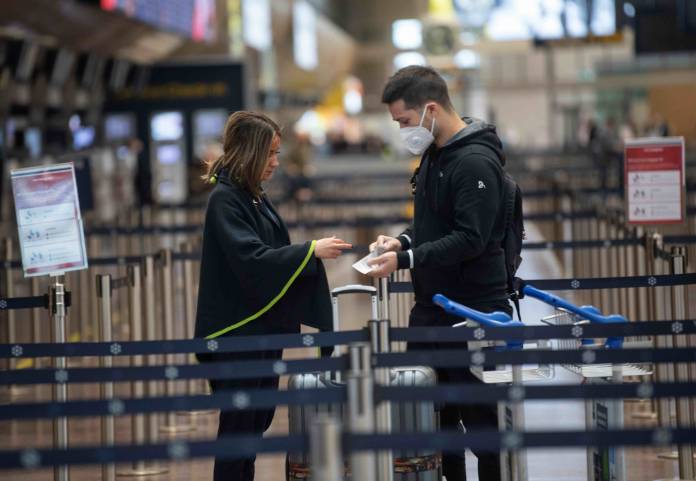 A traveler is seen at Arlanda International Airport following the coronavirus concern and cancelled flights in Stockholm A traveler is seen at Arlanda International Airport following the coronavirus concern and cancelled flights in Stockholm