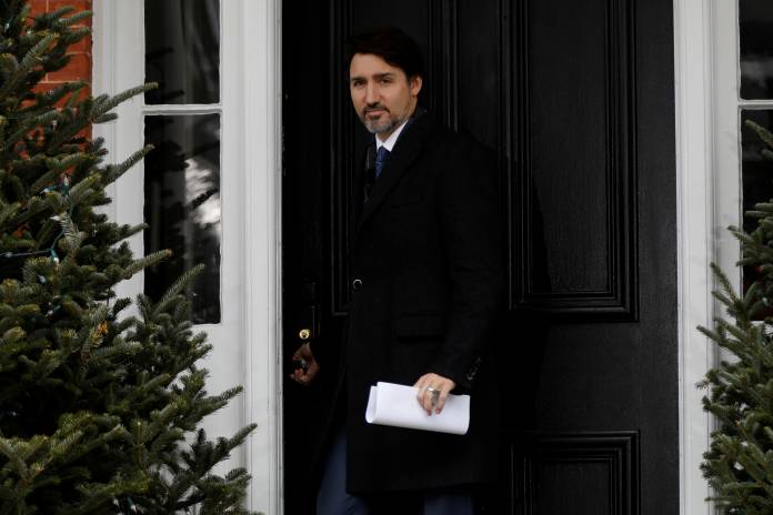 Canada's Prime Minister Justin Trudeau arrives for a news conference at Rideau Cottage in Ottawa Canada's Prime Minister Justin Trudeau arrives for a news conference at Rideau Cottage in Ottawa