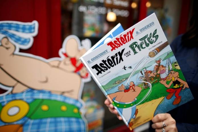 FILE PHOTO: A woman poses with the new comic book FILE PHOTO: A woman poses with the new comic book