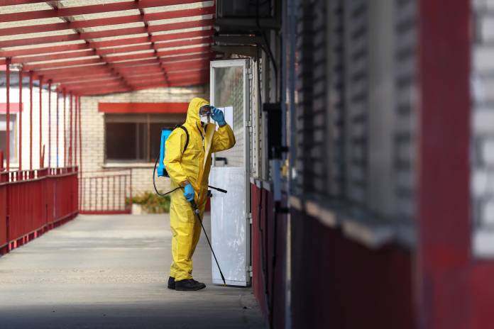 Member of Emergency Military Unit (UME) disinfects a corridor in a special facility for psychically disabled people in Getafe Member of Emergency Military Unit (UME) disinfects a corridor in a special facility for psychically disabled people in Getafe