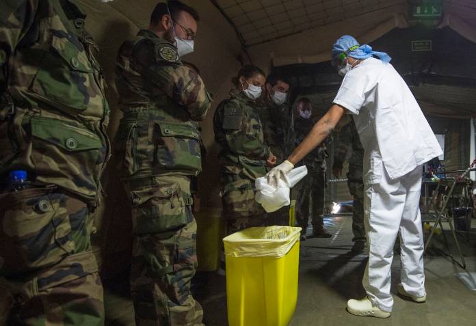 French soldiers work at a military field hospital before its opening in Mulhouse