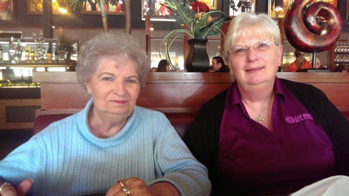 Debbie de los Angeles poses for a photo with her mother Twilla Morin in a restaurant in Washington