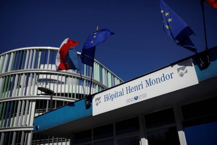 FILE PHOTO: A view shows the entrance at the Henri Mondor Hospital in Creteil, near Paris, as the spread of the coronavirus disease (COVID-19) continues in France, March 30, 2020. REUTERS/Benoit Tessier