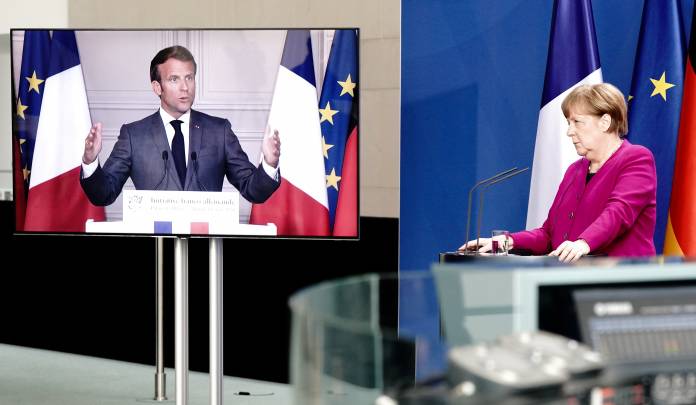 FILE PHOTO: German Chancellor Angela Merkel holds a joint video news conference with French President Emmanuel Macron
