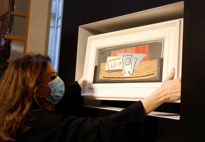 Charity raffle draw designates the winner of a Picasso oil painting for 100 euros at Christie's Paris