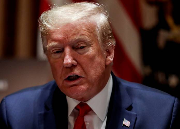 U.S. President Trump holds coronavirus response meeting with Governors Kelly and Hutchison at the White House in Washington