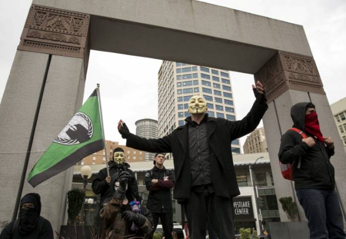 FILE PHOTO: Anonymous activists wearing Guy Fawkes masks rally in Westlake Park before the