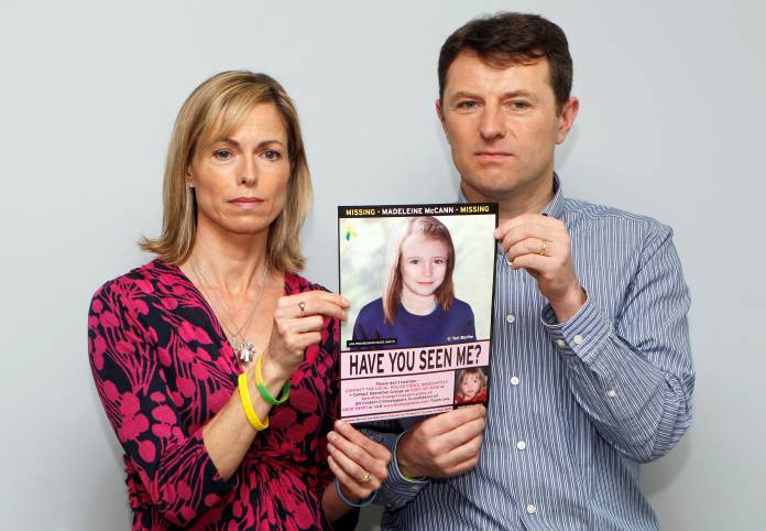 FILE PHOTO: Kate and Gerry McCann pose with a computer generated image of how their missing daughter Madeleine might look now, during a news conference in London