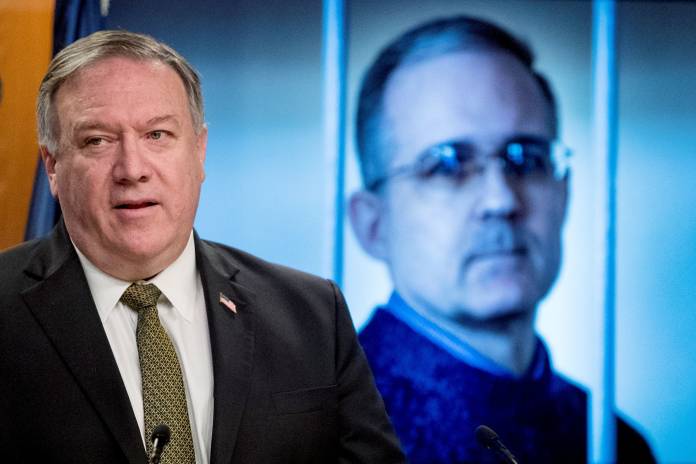 Secretary of State Mike Pompeo attends a news conference at the State Department in Washington