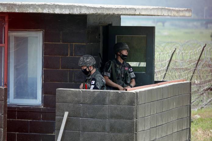 South Korean soldiers stand guard at their guard post near the demilitarized zone separating the two Koreas in Paju