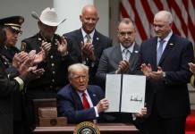 Trump signs order on police reform after weeks of protests about racial injustice