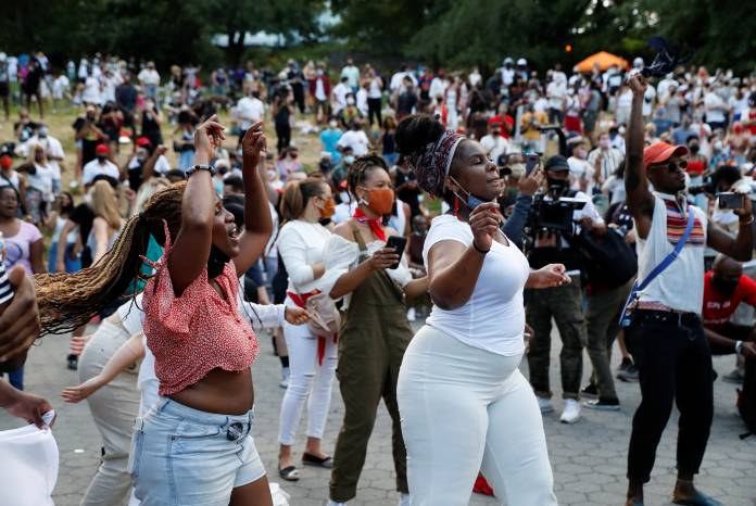 People take part in events to mark Juneteenth, which commemorates the end of slavery in Texas, in New York